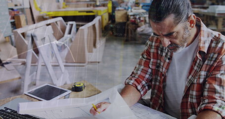 Image of financial graphs over senior caucasian man in carpentry workshop