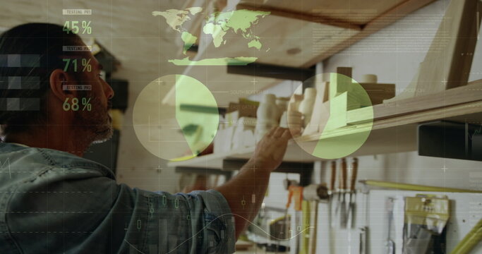 Image of data processing over caucasian male carpenter working in workshop