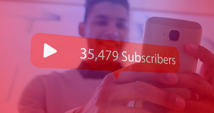 Increasing subscribers on red speech bubble against man using smartphone