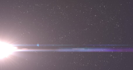 Naklejka premium Image of light on night sky with stars