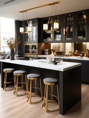 A kitchen interior featuring a black island with white countertop and four gold bar stools