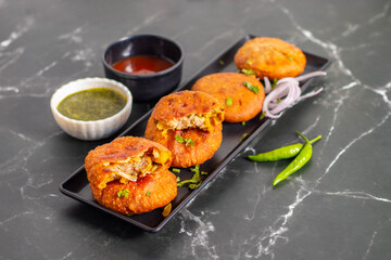 Onion kachori is a crispy, deep-fried Indian snack filled with spiced onion mixture, popular in Rajasthan, especially during tea time.
