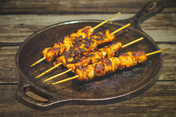 Chicken satay is grilled, marinated chicken skewers served with a rich, savory peanut sauce, popular in Southeast Asian cuisine.
