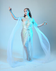 Fantasy studio portrait of a red-haired mermaid faery wearing a white pearl gown, fairytale...