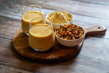 Sattu drink is a traditional, refreshing beverage made from roasted gram flour, often mixed with water, spices, and sometimes sweeteners, offering energy and digestive benefits.
