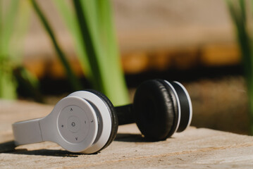 White wireless headphones on a terrace outdoors