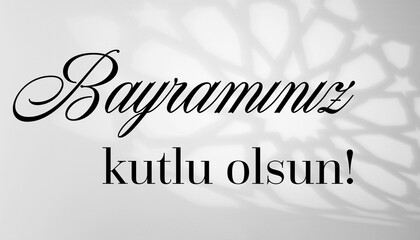 Bayramınız Kutlu Olsun Message on White Arabesque shadow background with traditional ornament, islamic design. Bayram greeting. Muslim holiday celebration. Modern, simple, black text.