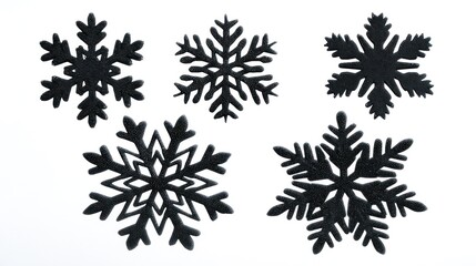 Five Black Glitter Snowflakes on White Background