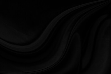Black gray satin dark fabric texture luxurious shiny that is abstract silk cloth background with patterns soft waves blur beautiful.