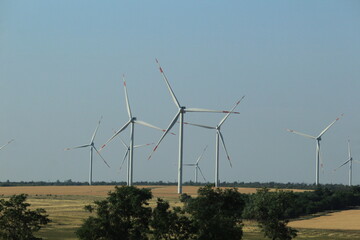 wind power plants in the fields of Solnechny on a summer day