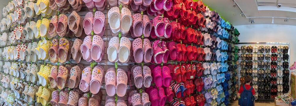 Honolulu, Hawaii, USA - 4.20.2025: Rows of Croc footwear and sandals at Princess Kaiulani