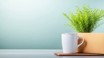 Obraz premium Minimalist Still Life with Green Plant in White Mug and Pot on Light Wooden Surface against Soft Blue Background for Contemporary Home Decor Design