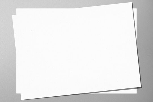 Top view stack of business letterhead on a gray background. Blank paper or sheet. Mockup or copy space for your design