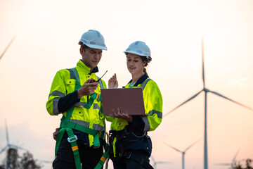 Technician and Engineer Working on a Windmill Turbine in the Field, Harnessing Renewable Energy for Sustainable Power Generation, Using Advanced Technology and Innovation to Support the Environmental