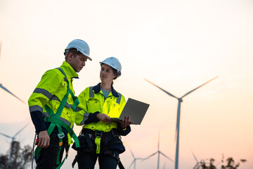 Technician and Engineer Working on a Windmill Turbine in the Field, Harnessing Renewable Energy for Sustainable Power Generation, Using Advanced Technology and Innovation to Support the Environmental