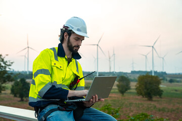 Technician and Engineer Working on a Windmill Turbine in the Field, Harnessing Renewable Energy for...