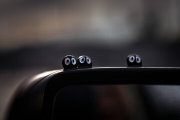 Rear view mirror with funny characters on top