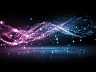 Abstract light trails of pink and blue energy flowing on black background studio shot for modern technology