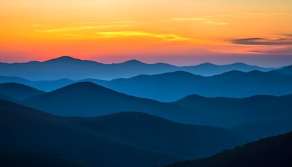 Obraz premium Vast mountain range silhouettes at breathtaking sunset.