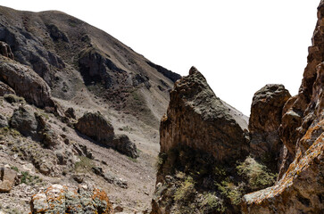 Arid Rocky Mountain Landscape with Dry Slopes, Boulders, and Vegetation under Harsh Sunlight in Remote Region. cut out object with transparent background