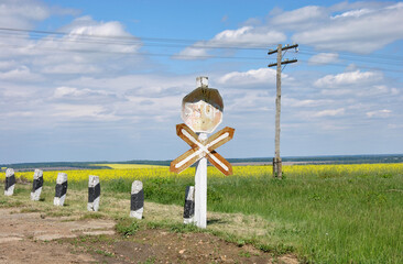 old railway crossing in the countryside on a sunny day