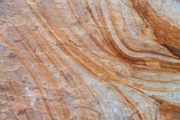 Close-up of weathered rock surface with layers.