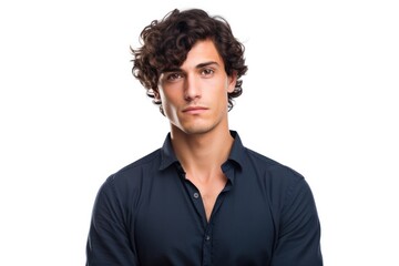 A young European man with short, curly black hair, wearing a casual navy blue shirt and a subtle, confident expression.