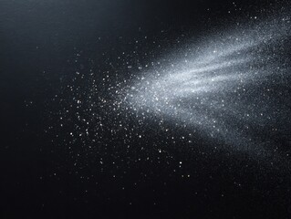 Obraz premium Scattered Stardust Creates a Mesmerizing Display on a Black Surface in Cosmic Elegance