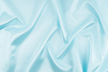 Texture of sky Blue silk.  Light blue fabric smooth surface background.