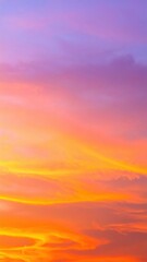 Fototapeta premium A breathtaking sunset paints the sky in vibrant hues of orange, pink, and purple, as the sun dips below the horizon, casting a warm glow.