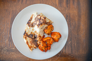 Spicy Chicken Tikka served butter naan bread