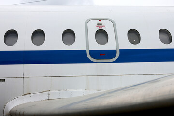 Airplane window from the outside at the airport.
