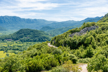 Obraz premium Landscape of Montenegro mountains, mountain range in haze summer