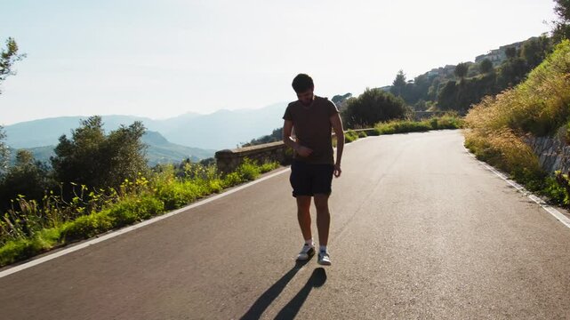 Athlete Trains Under The Sun Walking Backwards