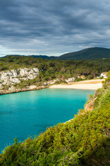Naklejka premium Turquoise bay with cliffs forest and beach in Mallorca Spain Cala Romantica