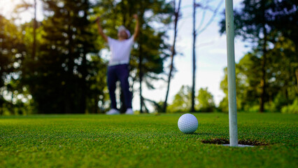 Golfers are putting golf in the evening golf course golf backglound.