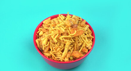 Indian Snacks, Traditional Indian deep fried salty dish called chivda or mixture or farsan made of gram flour and mixed with dry fruits and roasted nuts with salt, pepper, pulses, spice and green peas