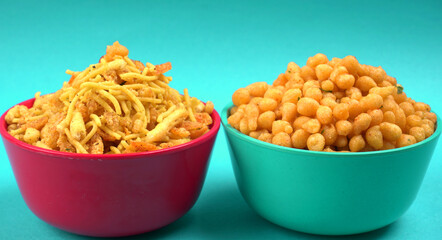 Indian Snacks, Traditional Indian deep fried salty dish called chivda or mixture or farsan made of gram flour and mixed with dry fruits and roasted nuts with salt, pepper, pulses, spice and green peas