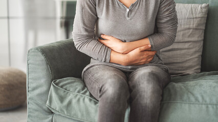 Young woman with stomach pain