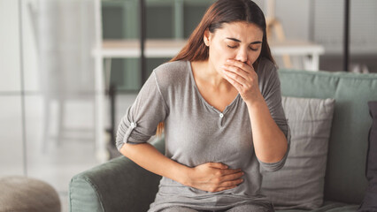 Young woman feeling nauseated
