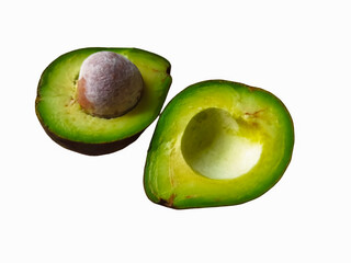 Avocado cut in half on white background showing fresh green fruit and seed
