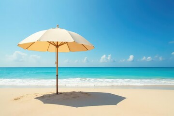 Large beige beach umbrella open on sandy beach, sandy beach, sea