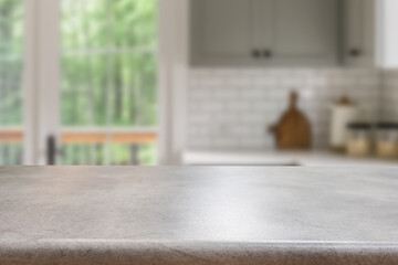 Empty wooden kitchen counter mockup, product display background. Wood table top on marble, blurred interior. Modern style home kitchen, restaurant advertising. Copy space