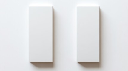 Two elegant white boxes placed on a minimalist white surface showcasing gourmet snack packaging mockup design