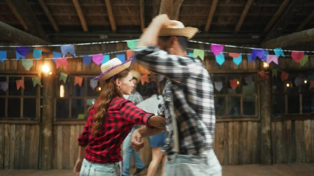 Radiant Woman with Vibrant Smile Participating in Festive Dance at Traditional Junina Event. Energetic Female in Country-Style Attire Dancing Towards Camera at Brazilian Celebration