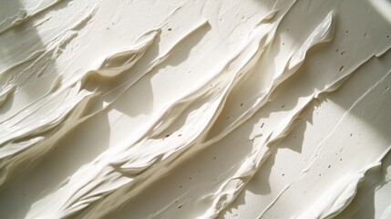 Obraz premium Abstract cream strokes on white surface