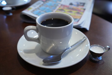 Coffee with Milk and Sport Journal at Cafe - 喫茶店のコーヒーとスポーツ新聞 朝のイメージ