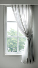 A sunlit window with a white frame draped with sheer, gray curtains