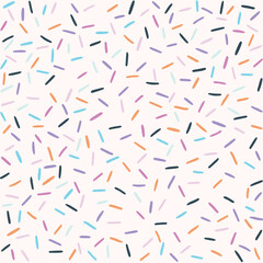 Seamless sprinkle pattern. Colorful background design with cute pastel colored sprinkles.