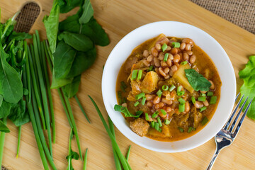 Hot dish of potatoes, meat and vegetables on a country table